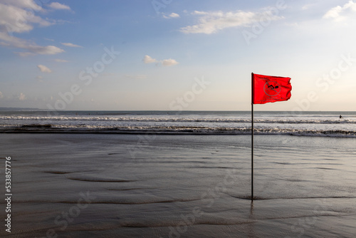 Red flag on the beach swimming forbidden © Garuda