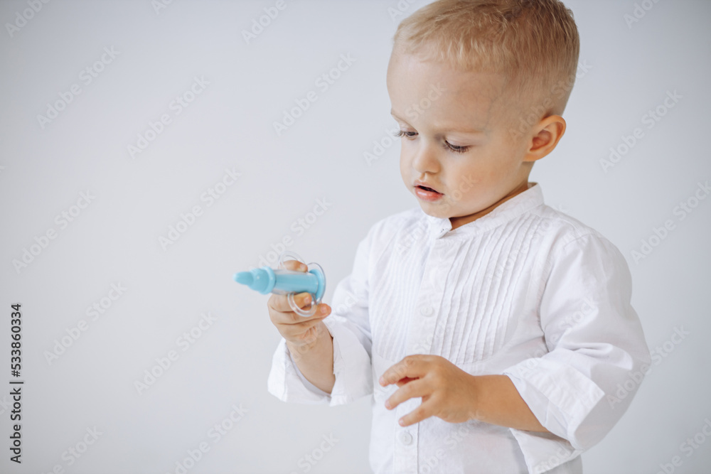 Cute little boy doctor with a medical prick Cute little boy doctor with a medical prick