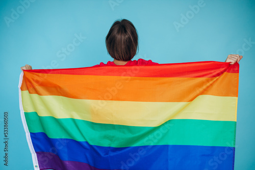 Woman waving lgbt colorful flag for equal right