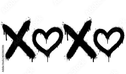 Spray Painted Graffiti xoxo Word Sprayed isolated with a white background. graffiti font xoxo with over spray in black over white. Vector illustration. photo