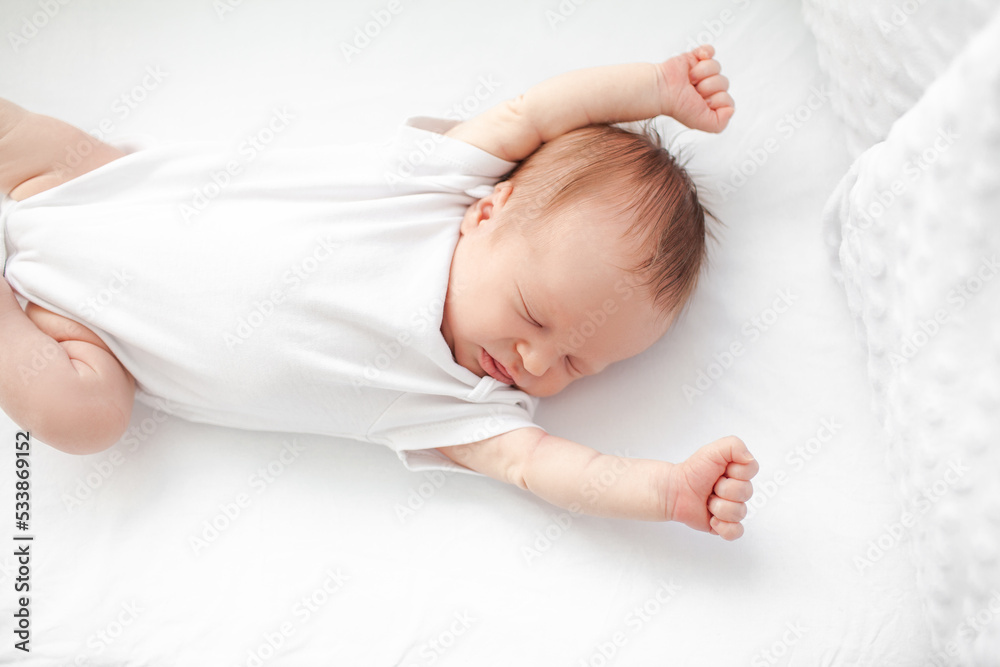 Home portrait of a sleeping newborn baby in a crib