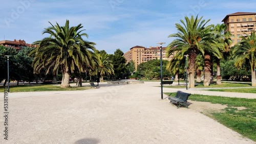 City park with palm trees on a sunny day in Zaragoza, Spain photo
