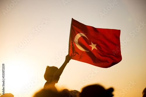 Bild auf Leinwand Close up shot of a Turkish flag on sunset.