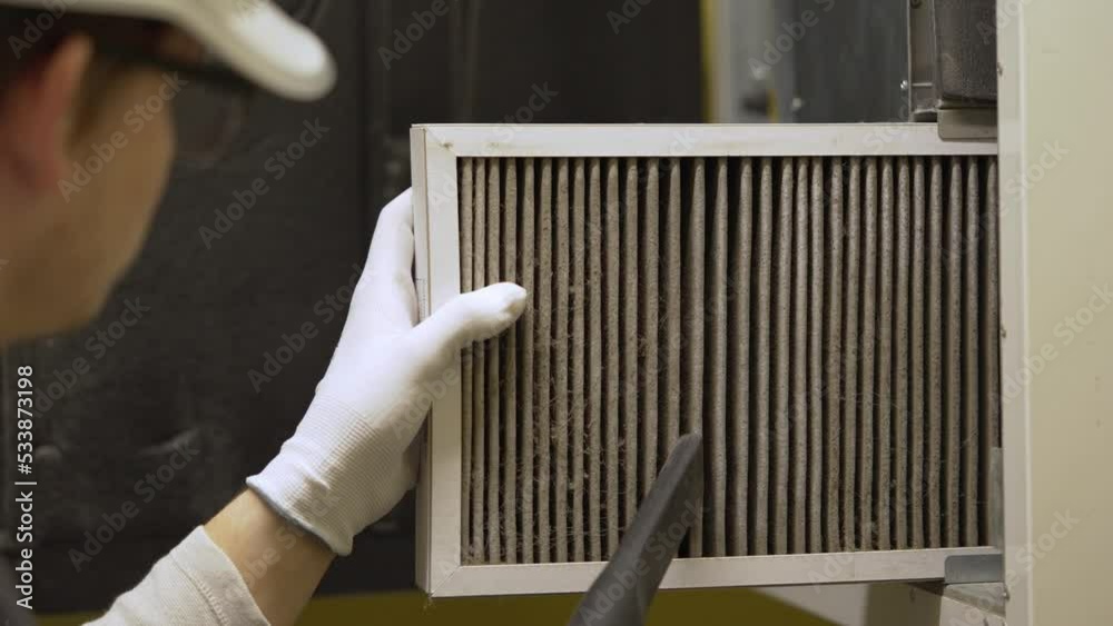 Stockvideo hvac filter replacing. Replacing the filter in the central