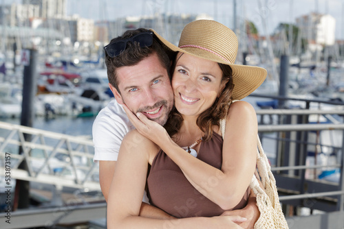 portrait of couple with a marine background