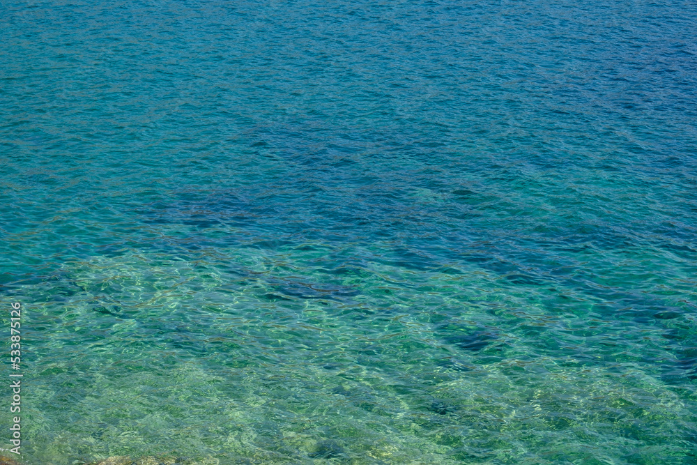 Transparent and clear turquoise water in Ios cyclades Greece