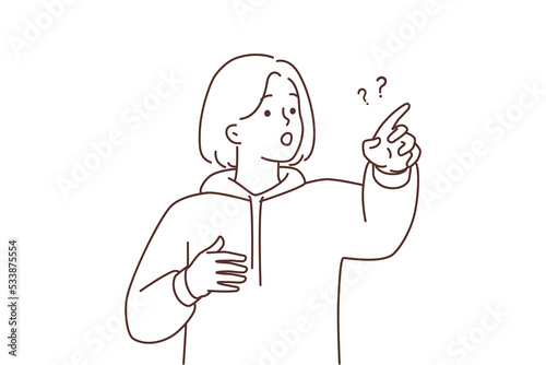Frustrated girl point with finger at something 
