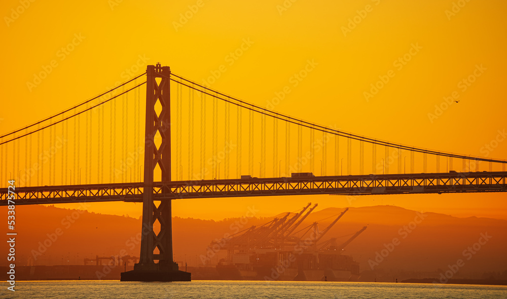 Obraz premium San Francisco Oakland Bay Bridge landmark, beautiful sunrise with spectacular sky. Travel to California, United States.