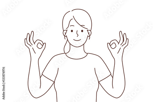 Smiling woman with mudra hands meditating 