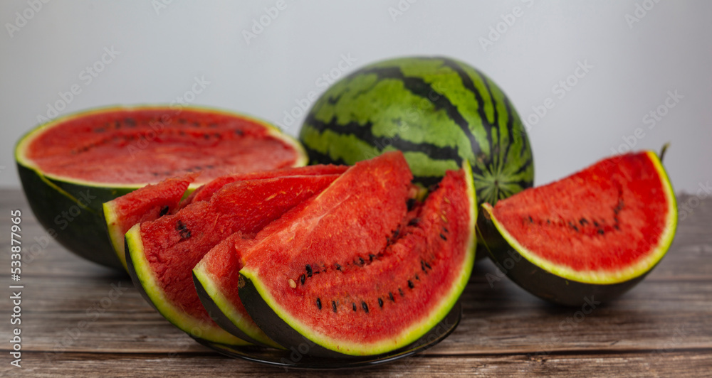 Ripe watermelon, cut into slices, close-up shot Ripe watermelon, cut into slices, close-up shot