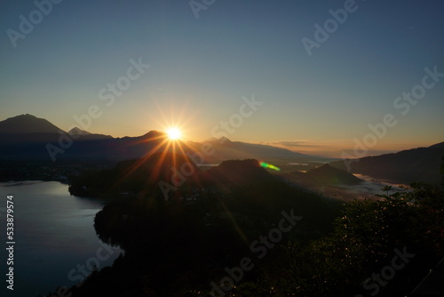 sunrise bled Island on lake from hill,Slovenia, Europe. Taken from the viewpoint at Ojstrica. Waking up world, mirrorinf in water