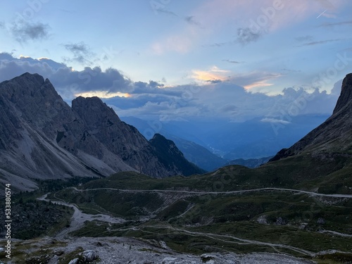 colorful sunset in mountains,Ausrtian Alps view from peack to valley. Multicolor clouds. Amazing landscape with mountain. Lienz Dolomites photo