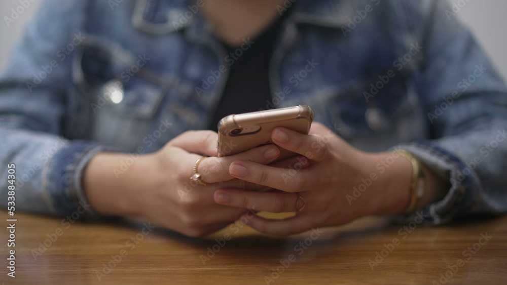 Closeup female hands holding cellphone. Girl texting message on smartphone. Person hand using phone