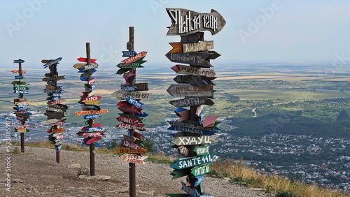 There are many way signs with the names of cities on Mount Mashuk. Pyatigorsk, North Caucasus, Russia.