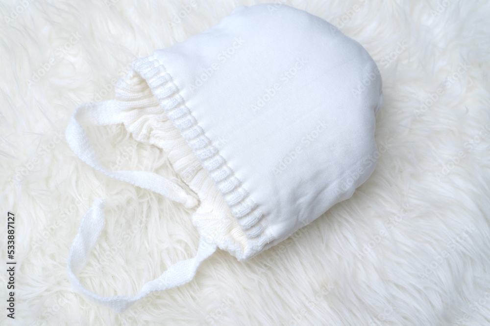 white baby woolen hat turned inside out. cotton lining white baby woolen hat turned inside out. cotton lining