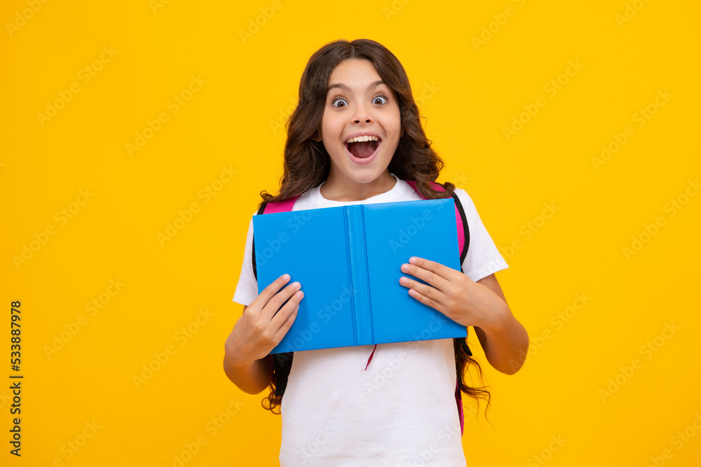 Back to school. Teenager school girl hold book and copybook ready to learn. School children with school bag on isolated yellow studio background. Shocked surprised teenager girl. Back to school. Teenager school girl hold book and copybook ready to learn. School children with school bag on isolated yellow studio background. Shocked surprised teenager girl.
