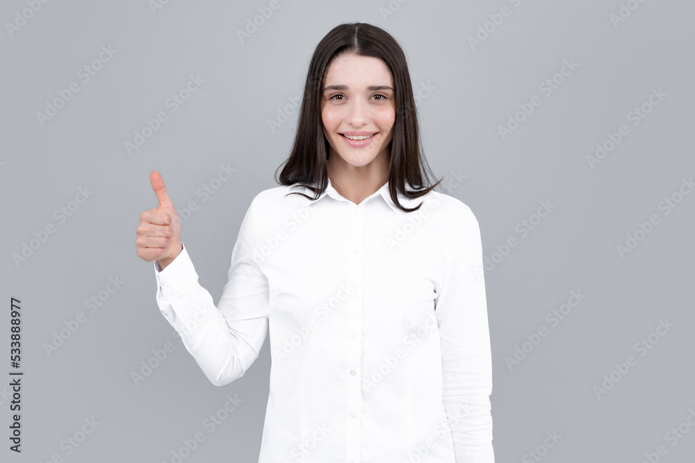 Woman point at copy space, showing copyspace pointing. Promo, girl showing advertisement content gesture, pointing with hand recommend product. Isolated gray background. Woman point at copy space, showing copyspace pointing. Promo, girl showing advertisement content gesture, pointing with hand recommend product. Isolated gray background.