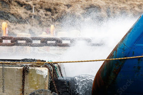 Using high pressure washing to remove deposits and debris on chains used in the offshore oil and gas industry thereby reducing the environmental impact.