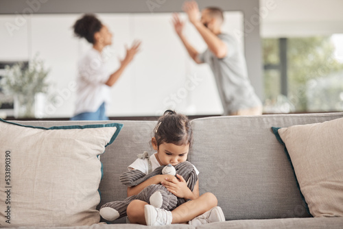 Foto Depression, stress or child trauma for girl with teddy bear on living room sofa and listening to fight, scream or shouting parents
