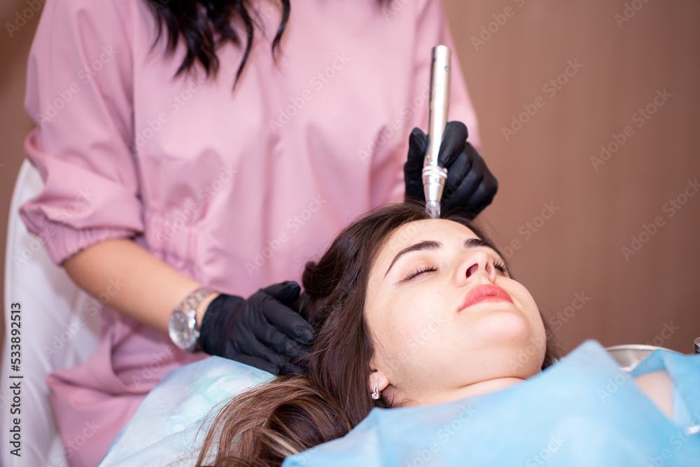 Treatment of the scalp for hair loss, alopecia. A trichologist doctor