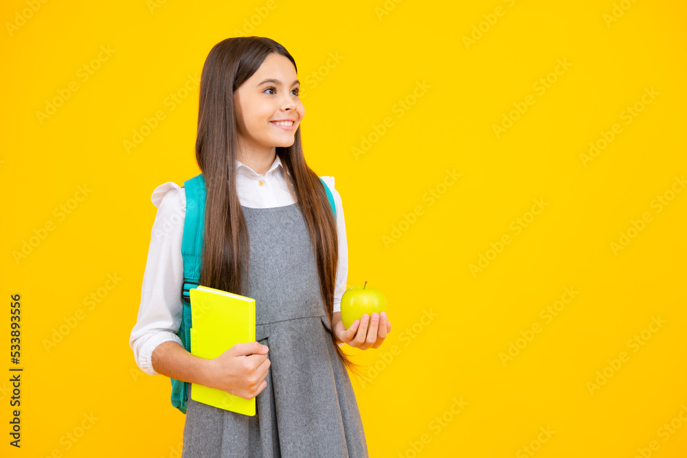 School kids concept. Back to school. Schoolchild, teenage student girl with bagpack hold apple and book. School kids concept. Back to school. Schoolchild, teenage student girl with bagpack hold apple and book.
