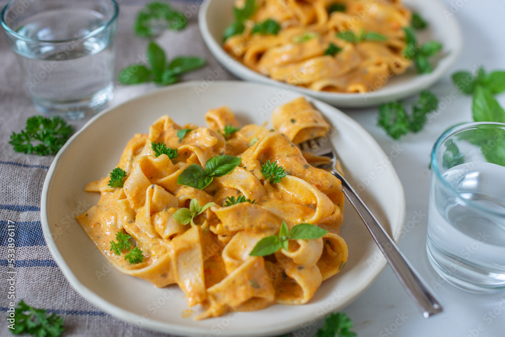 healthy home made pumpkin pasta tagliatelle on a table