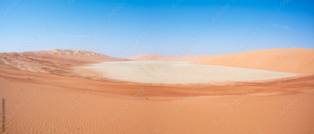 Sand dunes alternating with continental sabkha filled with salt flats. Abu Dhabi Emirates, United Arab Emirates, Middle East