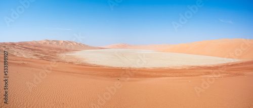 Sand dunes alternating with continental sabkha filled with salt flats. Abu Dhabi Emirates, United Arab Emirates, Middle East
