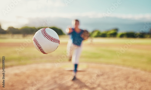 Baseball, sport and ball with a sports athlete or pitcher throwing and pitching a ball during a game or match on a court. Fitness, workout and exercise with an athletic person training outside