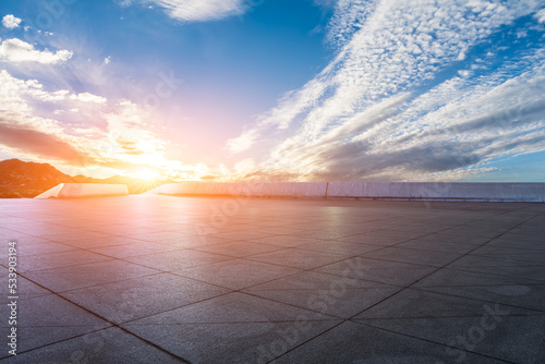 Empty square floor and sky sunset clouds background