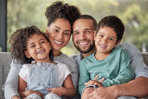 Smile, portrait and happy family love to relax together in a positive home on a fun weekend for bonding. Happiness, mother and father smiling with young Latino kids or children enjoying quality time photo