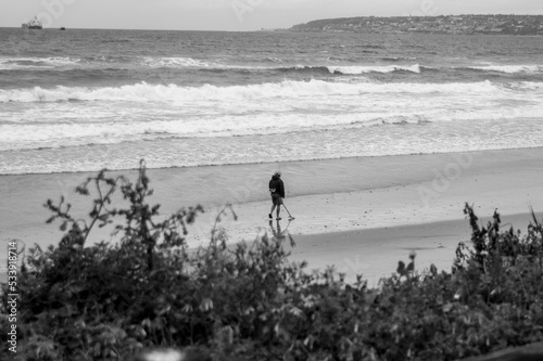 walking on the beach in searc of treasure photo