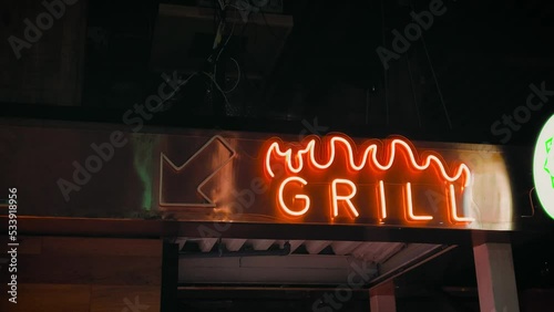 barbecue grill fire neon sign cafe restaurant arrow eat meat. High quality 4k footage. dinner business chickens