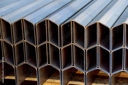 Bent metal products are stacked on a pallet. Work with sheet metal.