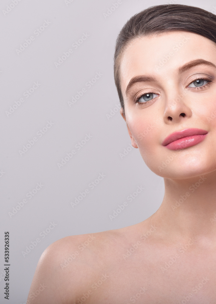 Beautiful face of young adult woman with clean fresh skin. Beautiful face of young adult woman with clean fresh skin.