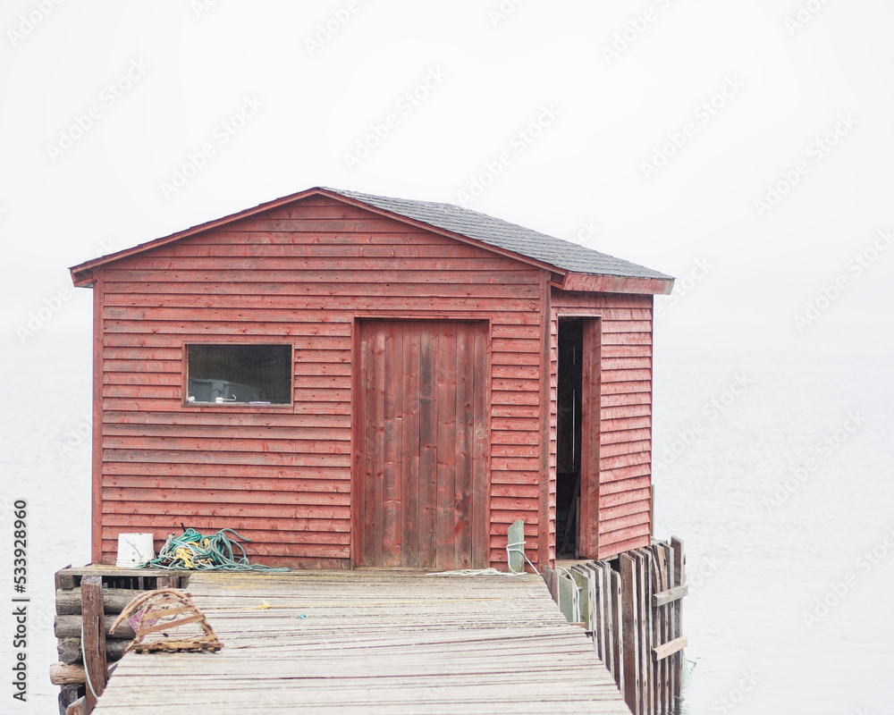 Iconic traditional red colored wooden fishing stages that are a part of the fishing culture of Newfoundland and Labrador, Canada.