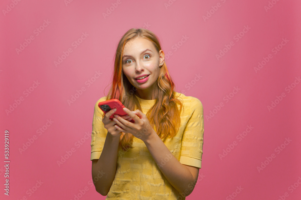Happy surprised young girl hold phone received unexpected news in social network shopping discount offer in online store
