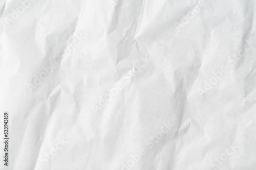 Wrinkled or crumpled white stencil paper or tissue used for background texture