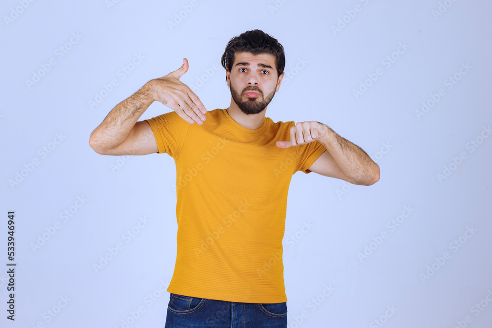 Man with beard showing negative hand sign Man with beard showing negative hand sign