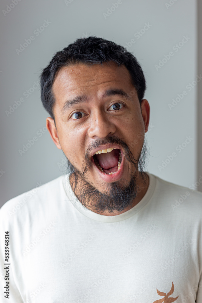 Handsome mustache asian man smiling and laughing Handsome mustache asian man smiling and laughing
