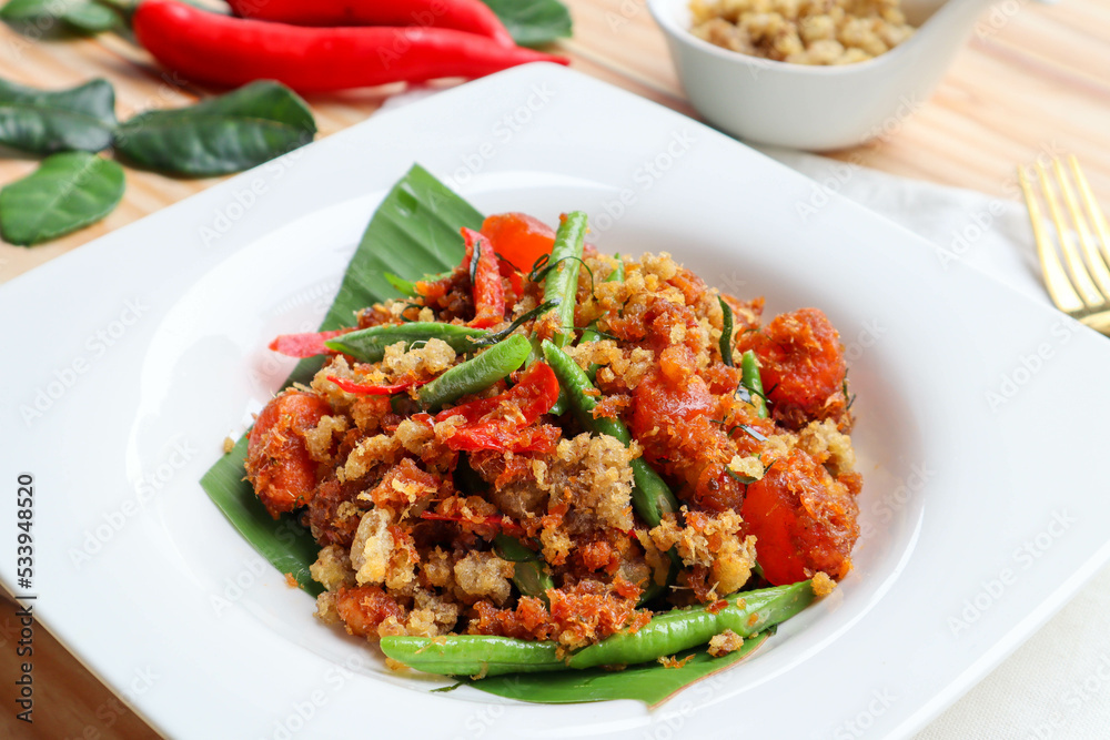 Pad Prik king - Stir fried deep fried catfish with curry paste , Thai food called Pad Prik King Pla dook foo at close up view Pad Prik king - Stir fried deep fried catfish with curry paste , Thai food called Pad Prik King Pla dook foo at close up view