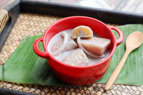 Banana in sweet coconut milk - Thai famous and healthy dessert called Kluay Buat Chee at close up view photo