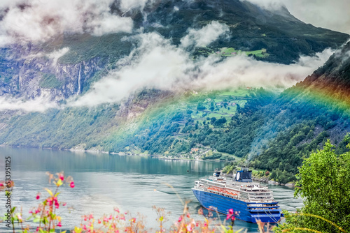 Stunning scenery with cruise ships in Norwegian fjords at Hellesylt and Geiranger