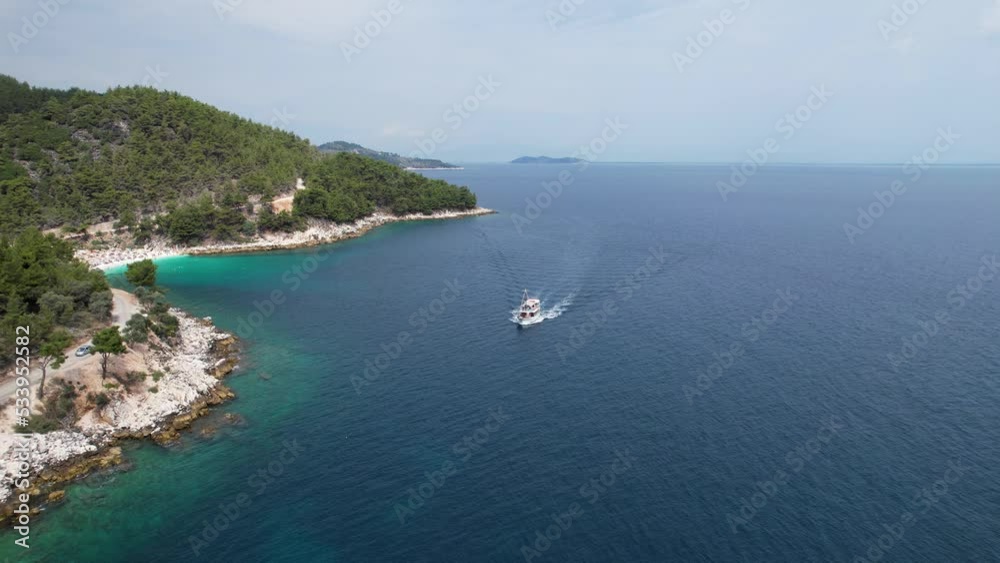 Aerial view of the beautiful Marble Beach on the Greek Island of Thassos in the Aegean Sea with turquoise waters. Drone footage of clear blue water with white sand on a summer day Aerial view of the beautiful Marble Beach on the Greek Island of Thassos in the Aegean Sea with turquoise waters. Drone footage of clear blue water with white sand on a summer day