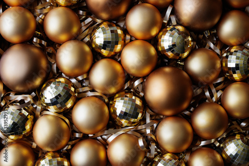 christmas and new year background - close up of golden Christmas baubles