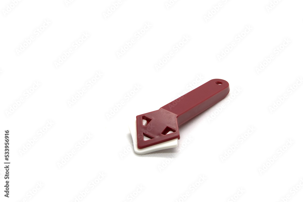 Plastic spatula for corners with a rubber pad for silicone