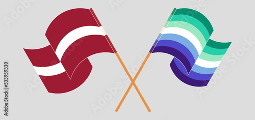 Crossed and waving flags of Latvia and gay men pride photo