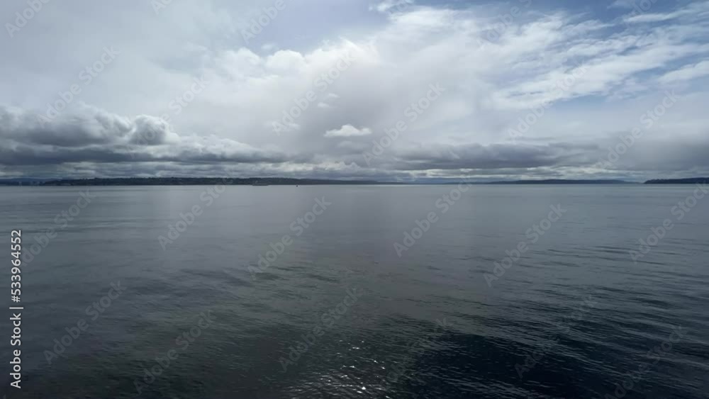 Blue sea water moving quickly beneath dramatic cloudy sky, hyperlapse Blue sea water moving quickly beneath dramatic cloudy sky, hyperlapse