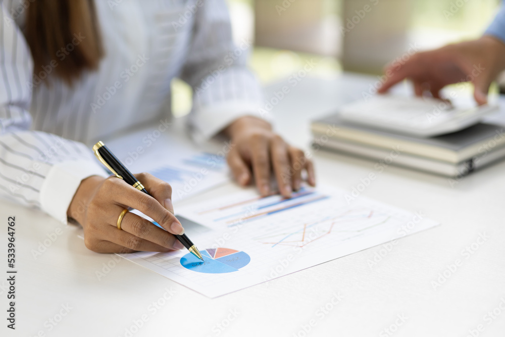 Businesswoman analyzing financial charts in company business report and market growth analysis. Accounting Concepts and Financial Planning Businesswoman analyzing financial charts in company business report and market growth analysis. Accounting Concepts and Financial Planning