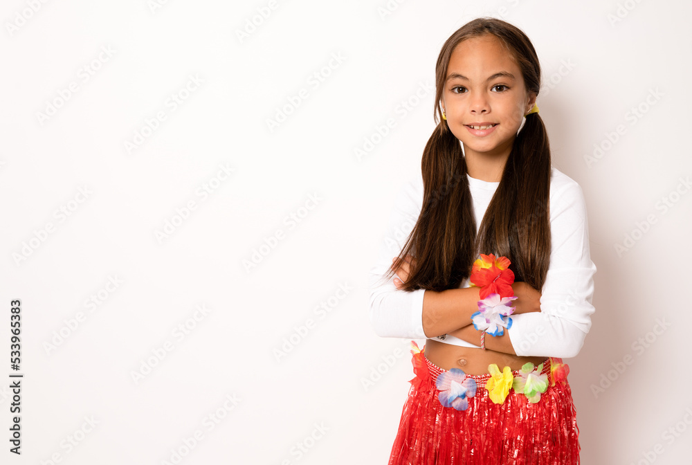 little child girl in hawaiian costume standing with arms folded isolated white background little child girl in hawaiian costume standing with arms folded isolated white background